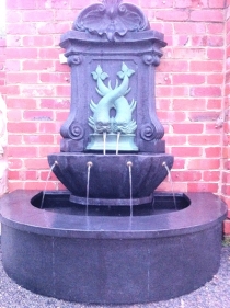 French wall fountain with matching GRC base pond